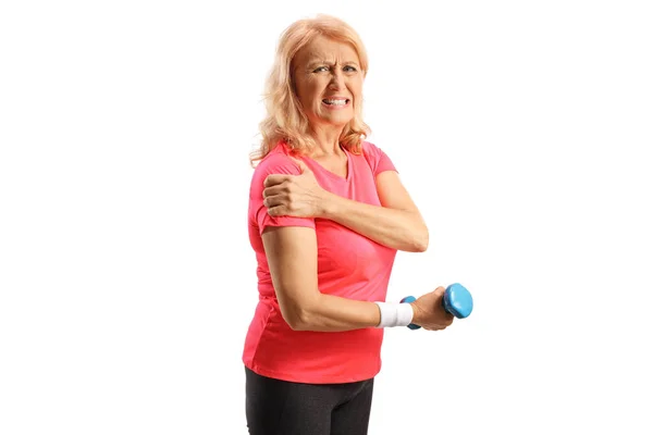 Mature Woman Sportswear Painful Shoulder Holding Dumbbell Looking Camera Isolated — Stock Photo, Image