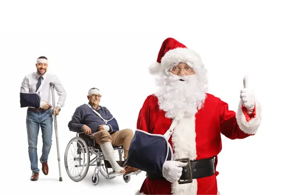 Santa Claus Con Lesión Brazo Señalando Pulgares Delante Hombres Heridos —  Fotos de Stock
