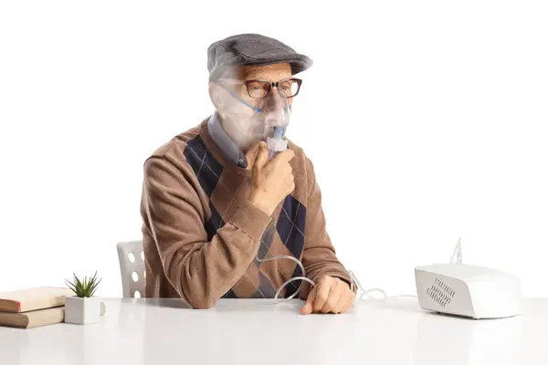 Elderly Man Sitting Table Using Nebulizer Vapor Mist Isolated White — Stock Photo, Image