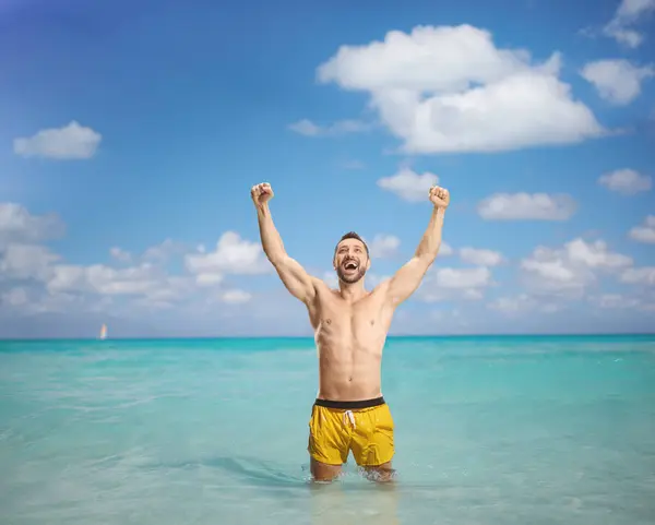 Excited Man Swimming Suit Standing Sea Raising Arms — Stock Photo, Image