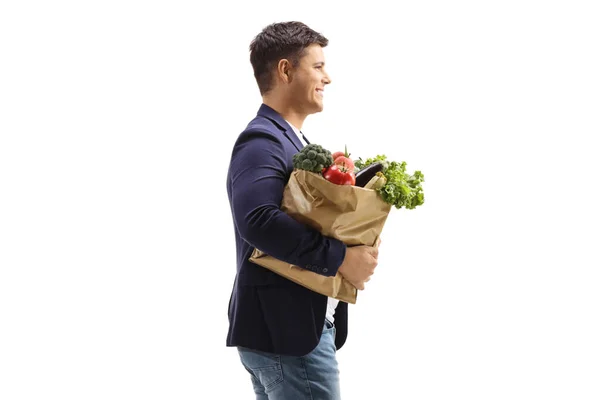 Profile Shot Man Carrying Paper Bag Groceries Isolated White Background — Stock Photo, Image