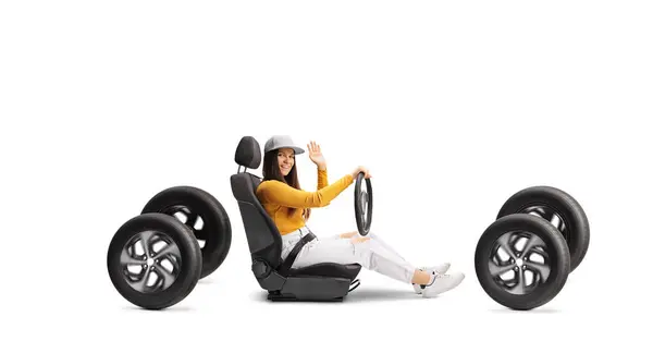 4つの車輪で運転し 白い背景で隔離された振動する若い女性 — ストック写真