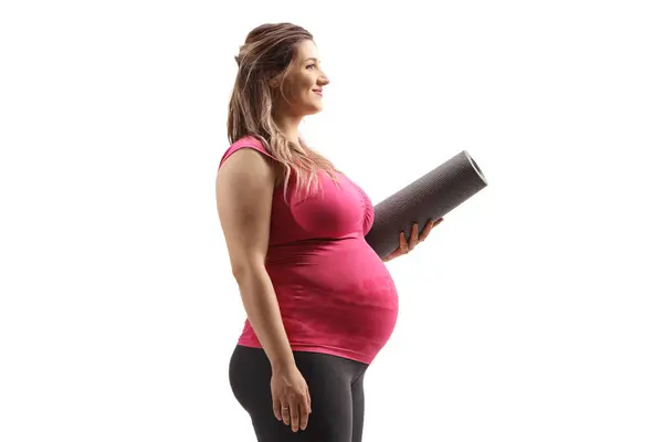 Perfil Una Mujer Embarazada Sosteniendo Una Esterilla Aislada Sobre Fondo — Foto de Stock