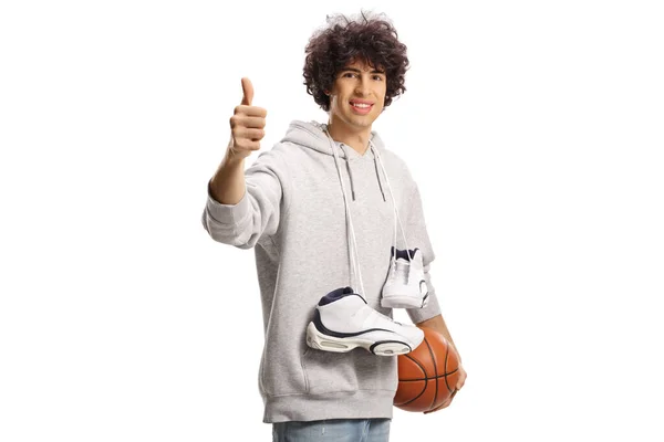 Smiling Young Man Carrying Basketball Shoes Ball Gesturing Thumbs Isolated — Stock Photo, Image