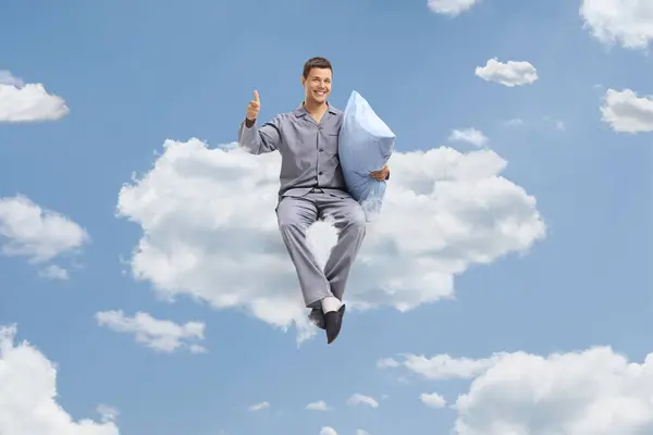 Young Man Pajamas Holding Pillow Gesturing Thumbs Cloud — Stock Photo, Image