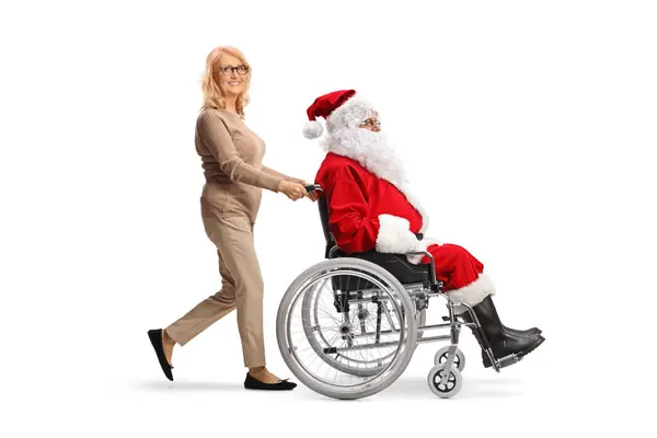 Mujer Mediana Edad Empujando Santa Claus Una Silla Ruedas Aislada —  Fotos de Stock