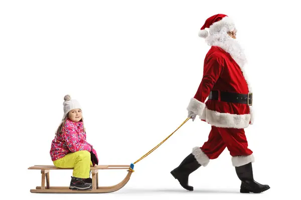 Santa Clus Τραβώντας Ένα Μικρό Κορίτσι Ένα Ξύλινο Έλκηθρο Απομονωμένο — Φωτογραφία Αρχείου