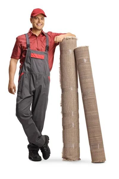 Male Worker Uniform Leaning Carpets Isolated White Background — Stock Photo, Image