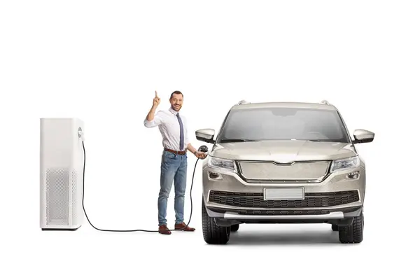 Businessman Pointing Charging His Electric Vehicle Isolated White Background — Stock Photo, Image