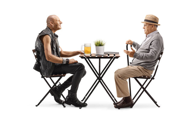 Pensioner talking to a punk with a pint of beer at a cafe isolated on white background