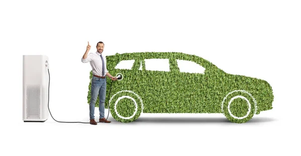Businessman Charging Green Hybrid Vehicle Pointing Isolated White Background — Stock Photo, Image