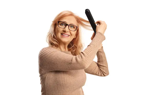 Middle Aged Woman Using Wireless Hair Straightener Isolated White Background — Stock Photo, Image