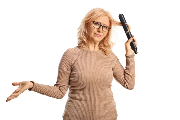 Confused Woman Using Hair Straightener Isolated White Background — Stock Photo, Image