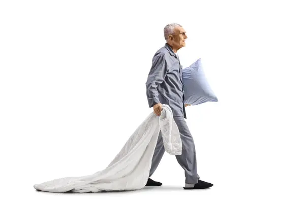 Elderly Man Pajamas Pulling Blanket Carrying Pillow Walking Isolated White — Stock Photo, Image