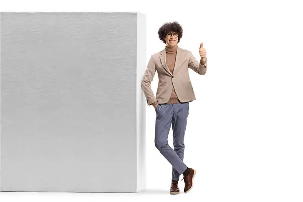 Tall Young Man Leaning Wall Gesturing Thumbs Isolated White Background — Stock Photo, Image