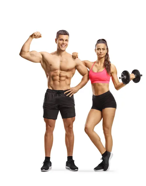 强壮的男人表现出肌肉和女人的哑铃分离的白色背景 健美和健身的概念 — 图库照片