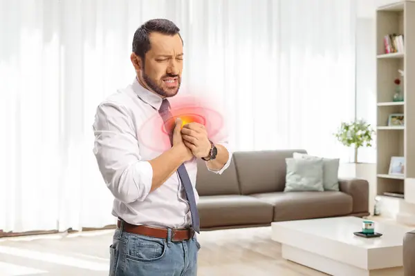 Businessman Living Room Holding His Chest Pain Home Health Issue — Stock Photo, Image
