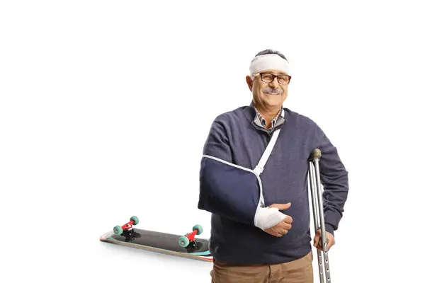 Mature Man Broken Arm Bandage Head Leaning Crutch Injured Skateboard — Stock Photo, Image