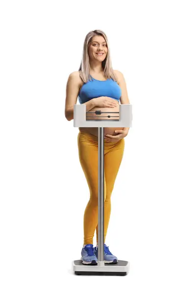 Pregnant Woman Sportswear Holding Her Belly Standing Medical Weight Scale Obraz Stockowy