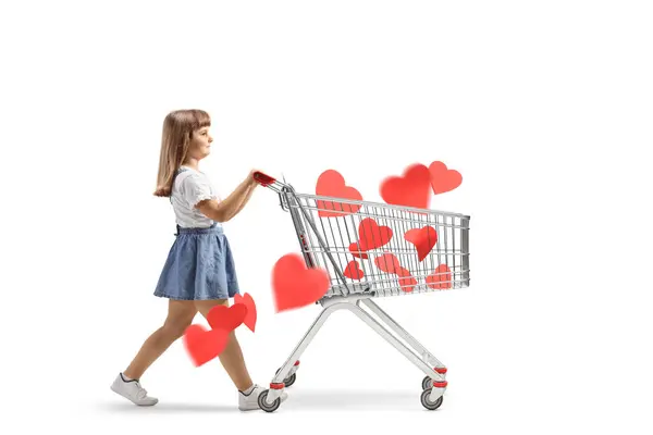 Little Girl Walking Pushing Shopping Cart Red Hearts Isolated White Stockfoto