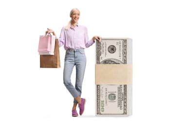 Woman with a stack of money and shopping bags isolated on white background clipart