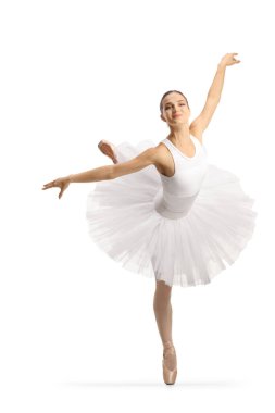 Beyaz bale elbisesi içinde beyaz arka planda yalnız dans eden kadın balerin.