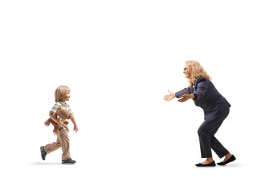 Boy with a teddy bear walking towards a woman isolated on white background