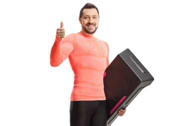 Man holding a step aerobic platform and showing thumb up isolated on white background