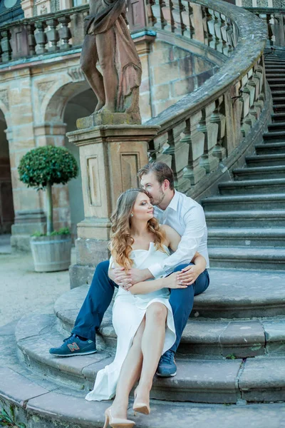 Beautiful young couple in love near the old palace. Wedding.