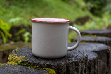 White mug on nature close up photo