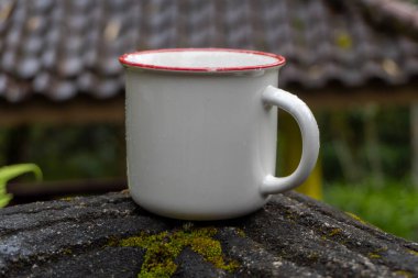 White mug on nature close up photo