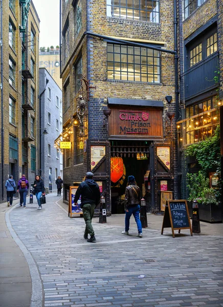 stock image London, UK: Clink Street in Southwark near London Bridge and Borough Market. Showing pedestrians and the Clink Prison Museum.