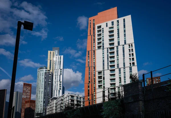 stock image Nine Elms, London, UK: Colorful residential buildings in Nine Elms, London including Haydn Tower at Nine Elms Point (front). Railway in foreground.