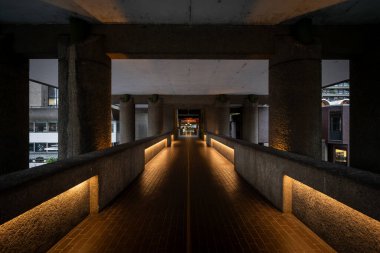 London, UK: High-level walkway on the Barbican Estate in the City of London leading to the Barbican Centre. The Barbican Estate is a prominent example of Brutalist architecture in London clipart