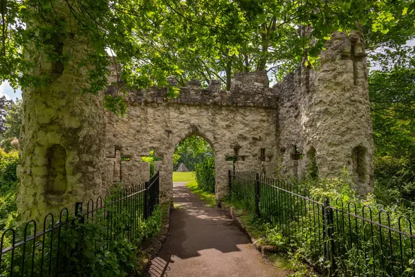 Stock image Castle Grounds, a public park in Reigate, Surrey, UK. While the castle no longer exists, a mock medieval gateway was built over the ruins in 1777.