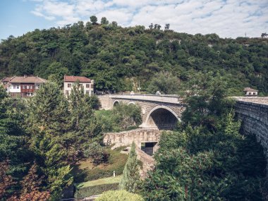Old historical stone bridge over Yantra river in Veliko Tarnovo, Bulgaria.