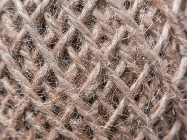 Close up macro with threads twisted together in a ball of strings.