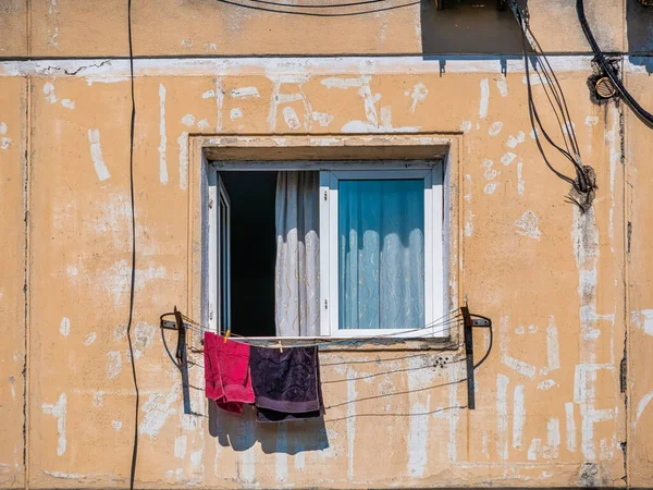 stock image Worn out apartment building from the communist era against blue sky in Bucharest Romania. Ugly traditional communist housing ensemble.