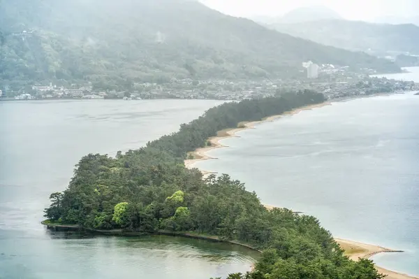 stock image View from the mountain top with the Amanohashidate Sandbar, Japans three most scenic views. Pine covered sandbar