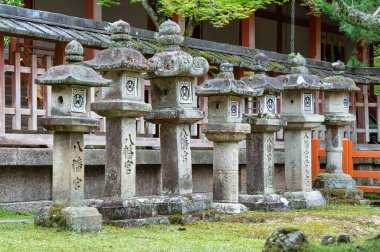 Tachi-doro japanese stone lanterns in a row at Todaiji Buddhist temple in Nara. clipart