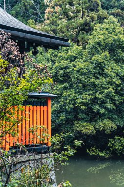 Scenic Japanese landscape with Kodamagaike Pond and Kumataka Shrine of Fushimi Inari (Thousand Torii Gates), in Kyoto, Japan.