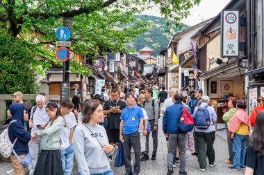 Kyoto, Japan - 05.07.2024: Crowded pedestrian area in the old town of Kyoto. clipart