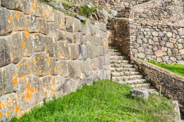 Historic Inca stone stairway at Ollantaytambo archaeological site in the Sacred Valley of Peru.