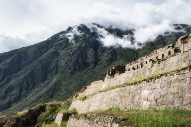 Scenic landscape view with Ollantaytambo Archeological Site in the Sacred Valley of the Incas, Peru.