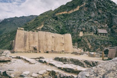 Temple del Sol or Sun Temple, a wall of six monoliths stone blocks at Ollantaytambo archaeological site, in the Sacred Valley of Peru