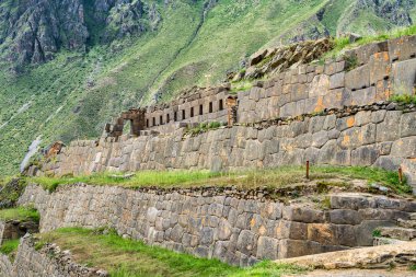 Ollantaytambo , Peru - March 17, 2025: Tourists exploring Ollantaytambo Archaeological Site, a major Inca ruin and popular attraction in the Sacred Valley