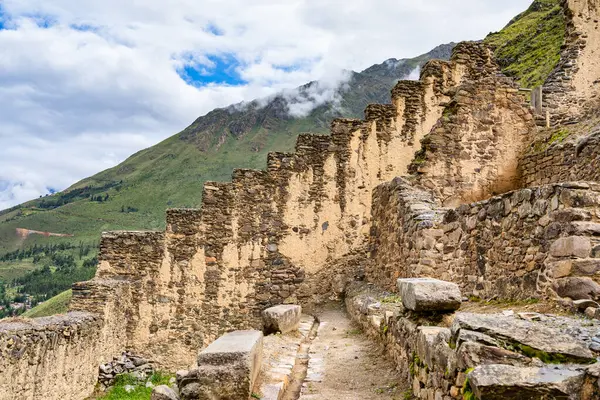 Scenic landscape view with the inca ruins at Ollantaytambo Archeological Site in the Sacred Valley of the Incas, Peru.