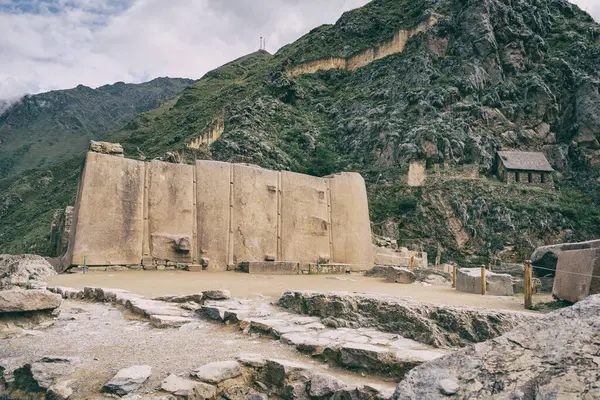 Temple del Sol or Sun Temple, a wall of six monoliths stone blocks at Ollantaytambo archaeological site, in the Sacred Valley of Peru