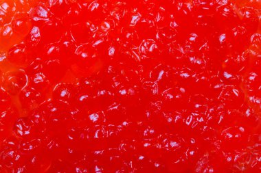 Close up photo texture of red caviar.