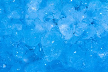 Close up photo texture of iced frozen blue toned water drops surface.